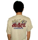photo of a man facing away from the camera. He is wearing a white shirt featuring garbled text made up of a nonsensical combination of characters